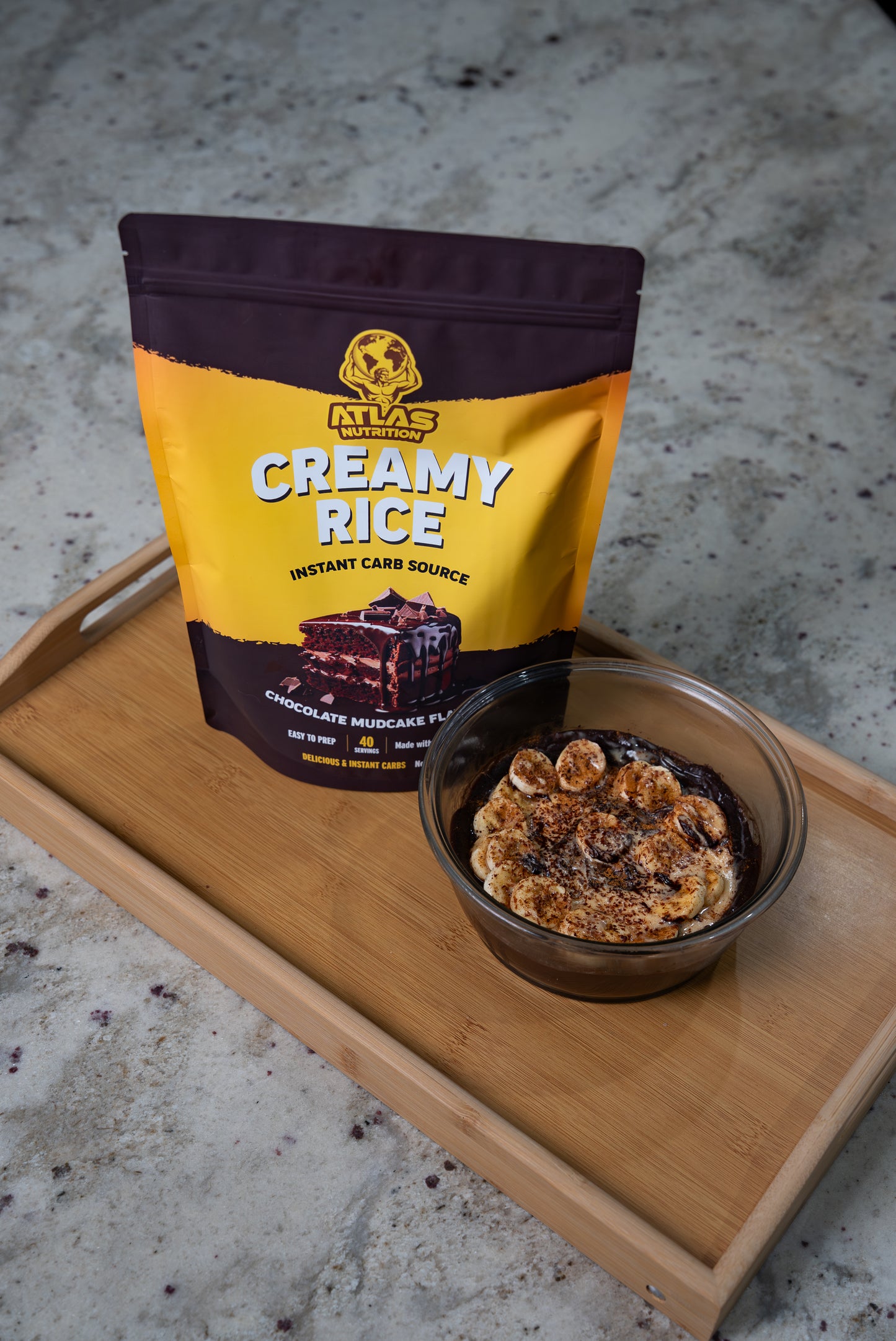 Atlas Nutrition Chocolate Mudcake Cream of Rice — prepared bowl with banana topping